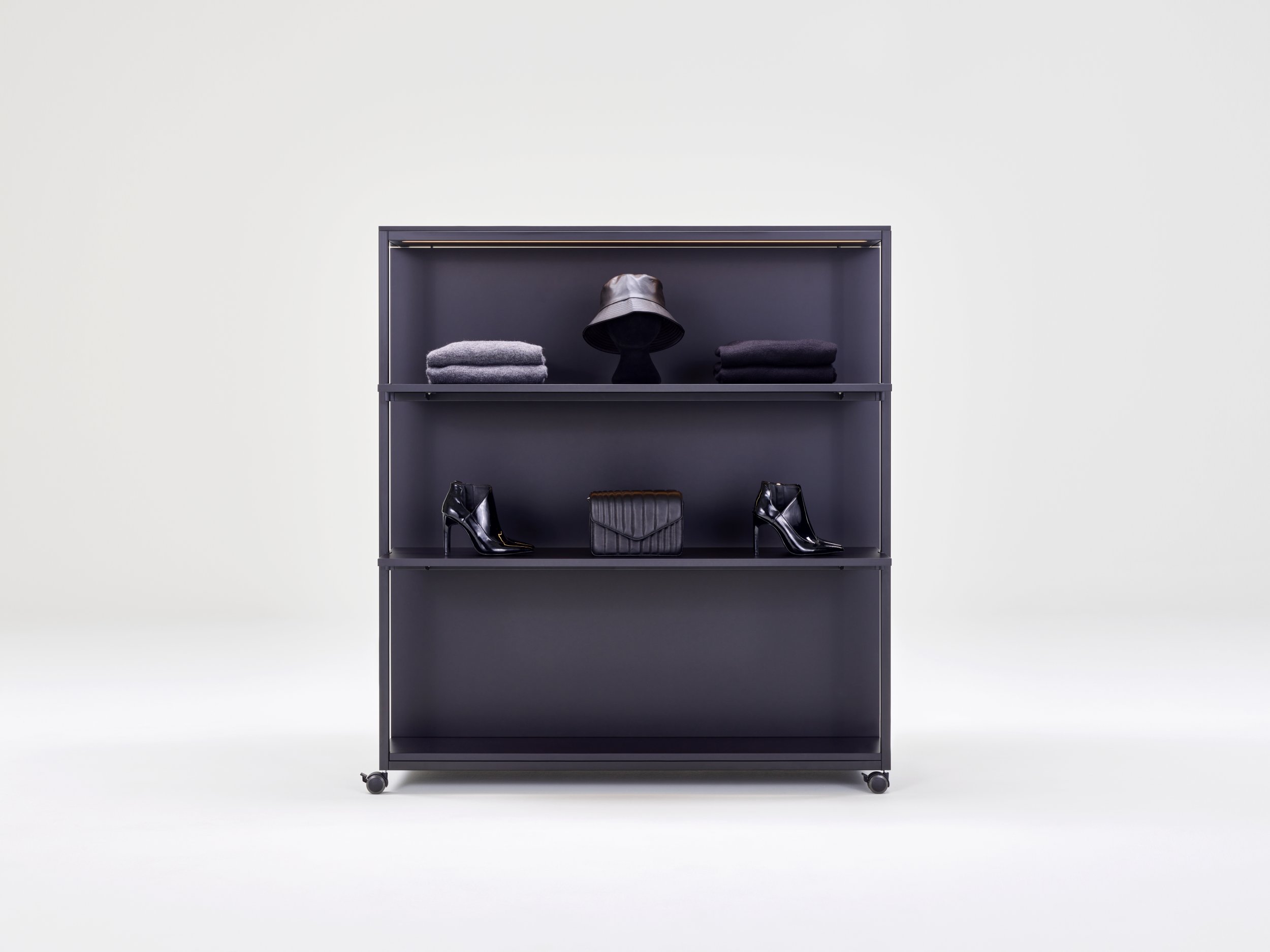 Qubo M module on castors equipped with fashion merchandise.