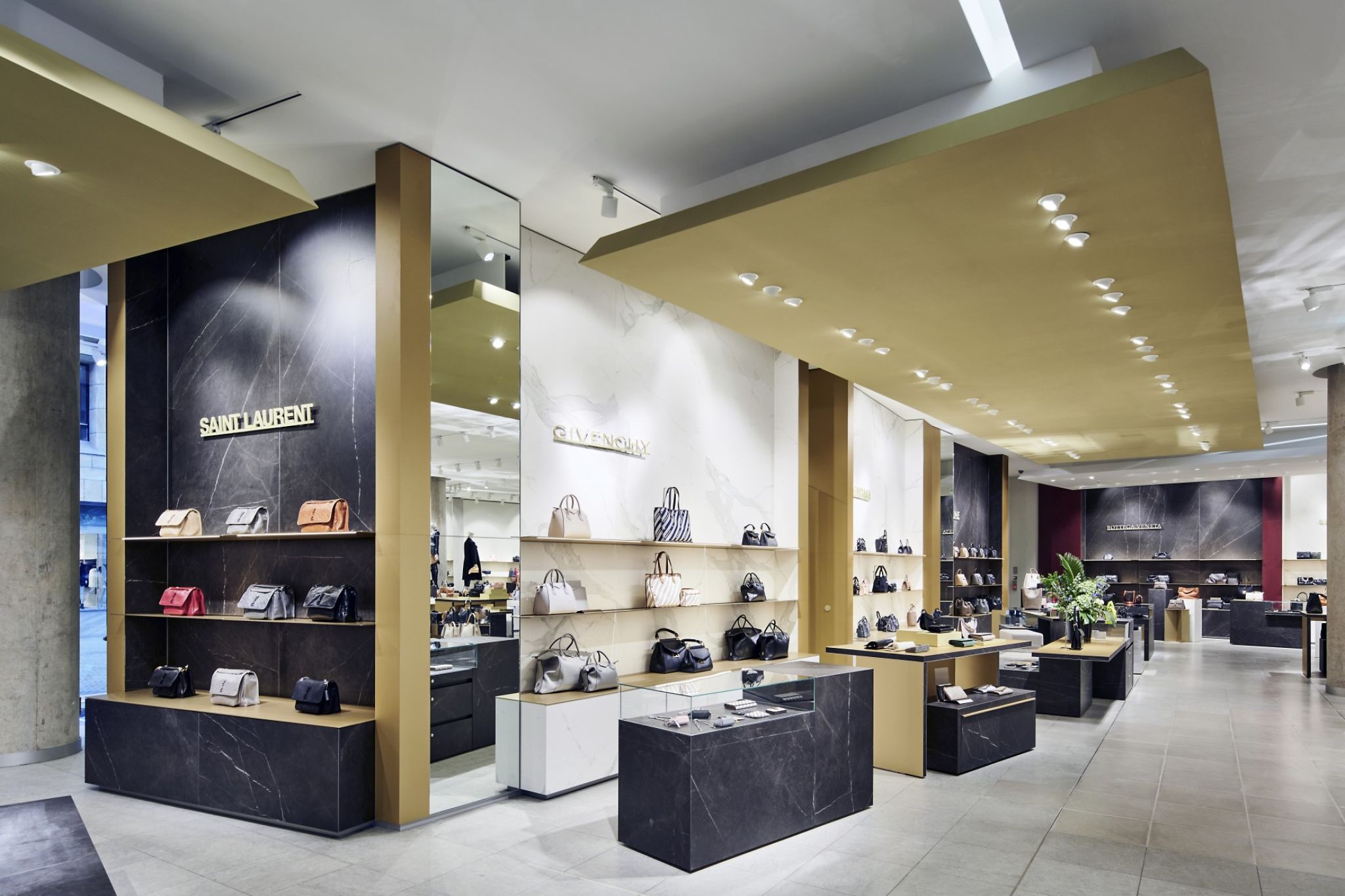 Modern commercial space equipped with luxury handbags and shoes.