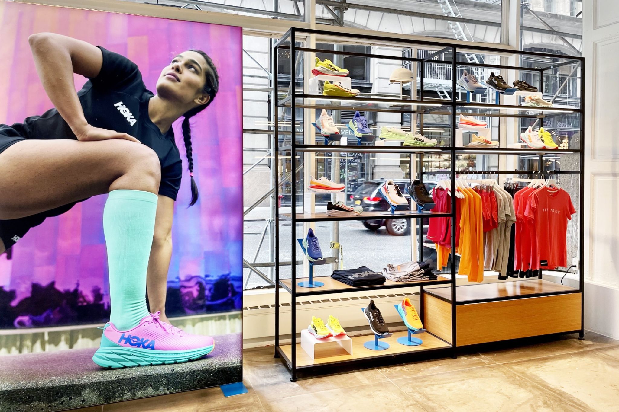 A shop window from the interior of a sports shoe store.