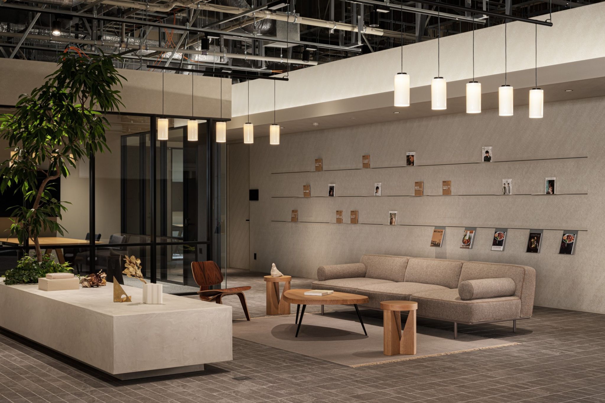 A bright room with modern lounge furniture and a couch area.