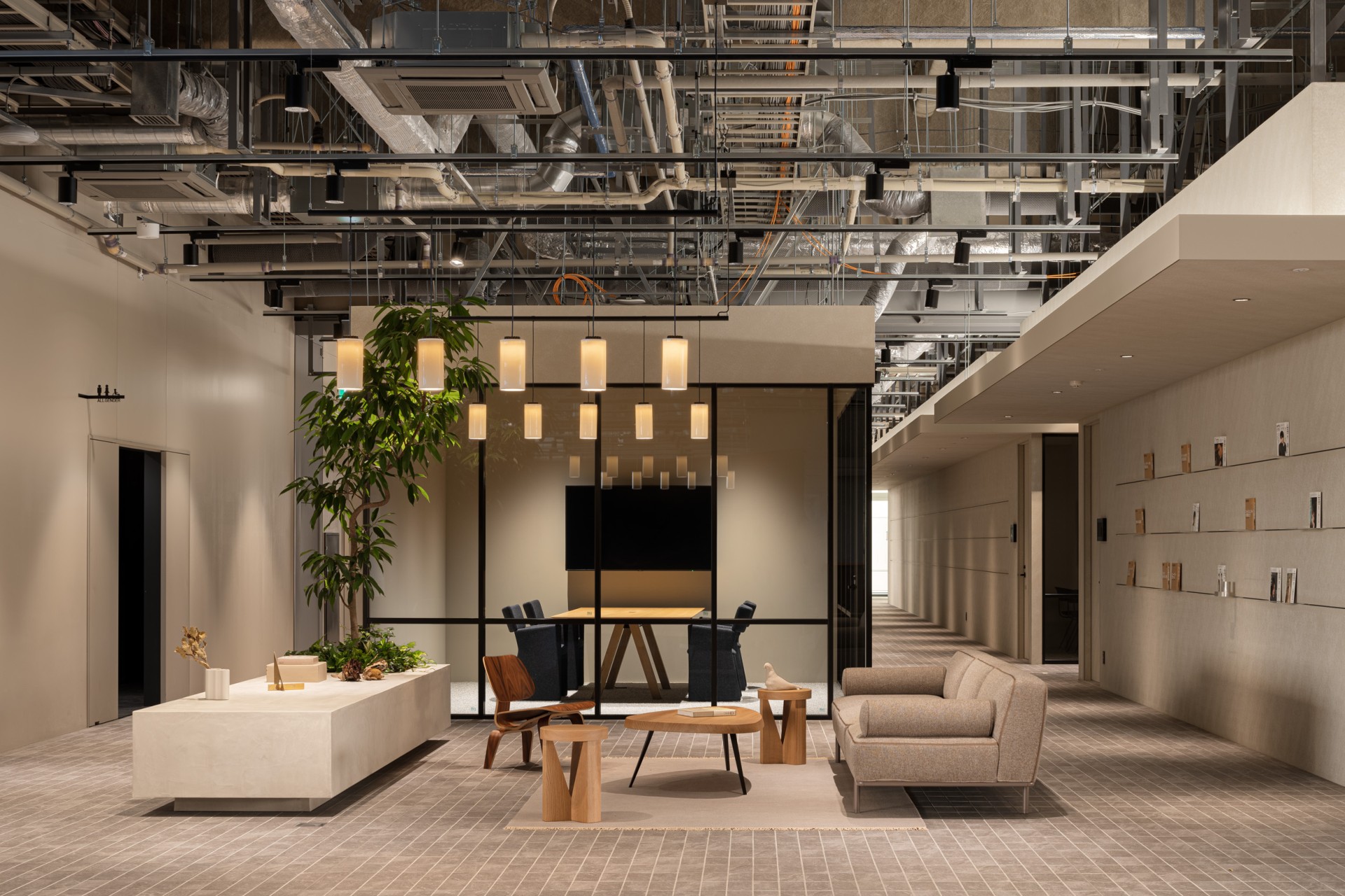 A bright room with beige modern furniture.