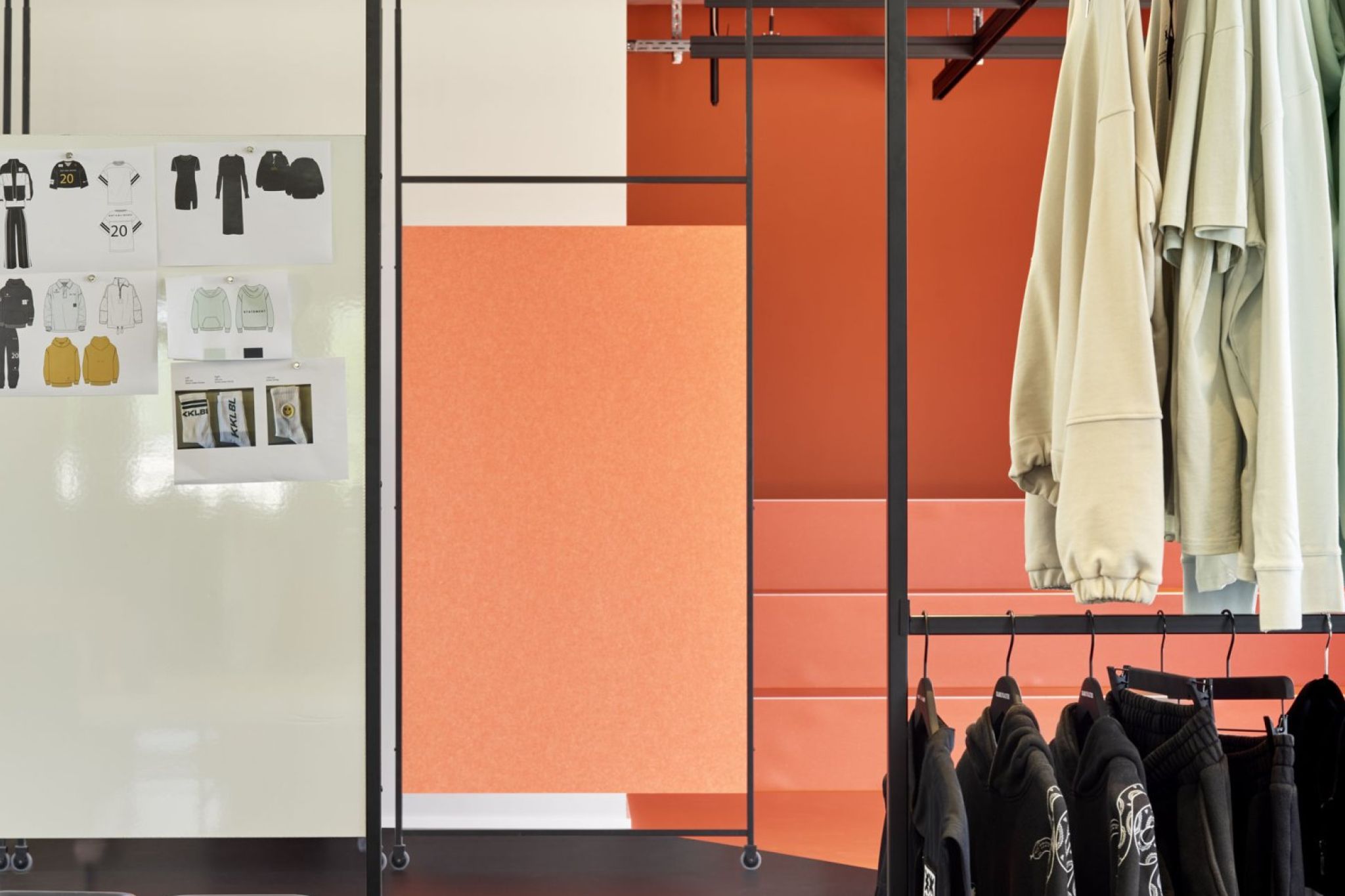 Whiteboards and dress patterns from Karo Kauer Label presented using Visplay's Multi-Lane ceiling track system.