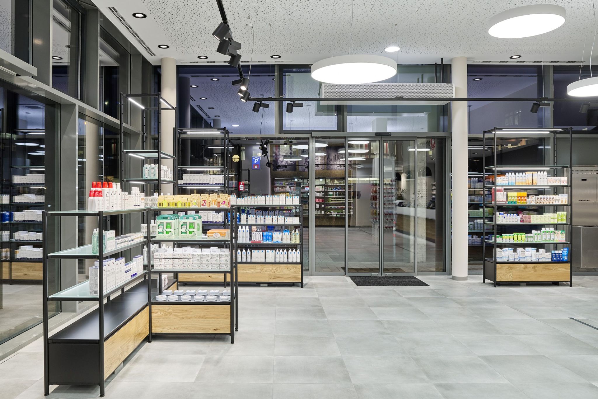 Interior of a pharmacy with view to the shop window.