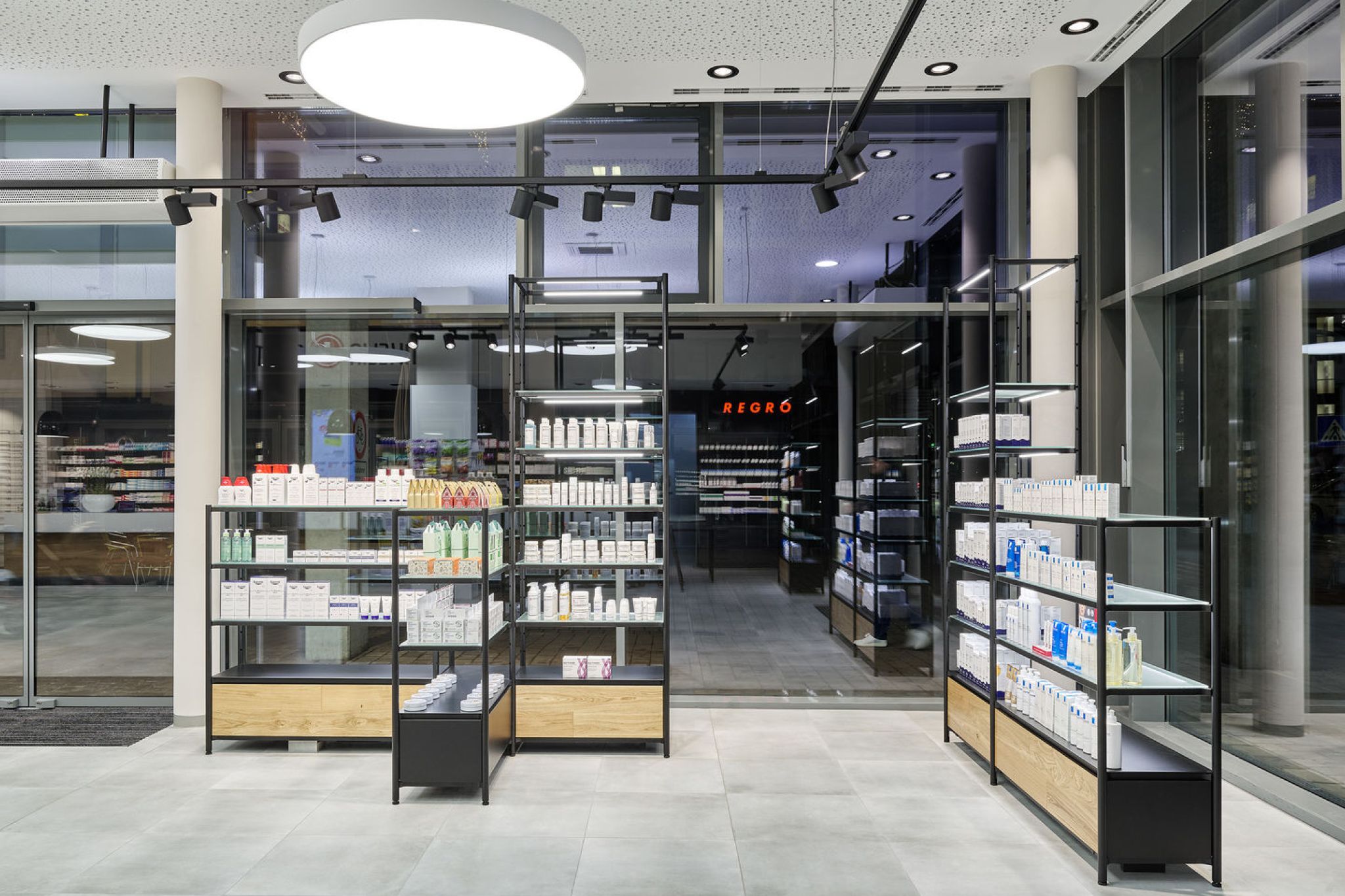 Interior design of a pharmacy with equipped shelves.