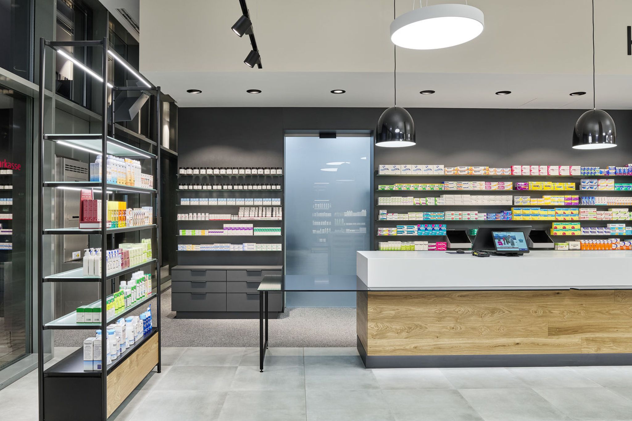 Interior of a pharmacy with view to the cash register.