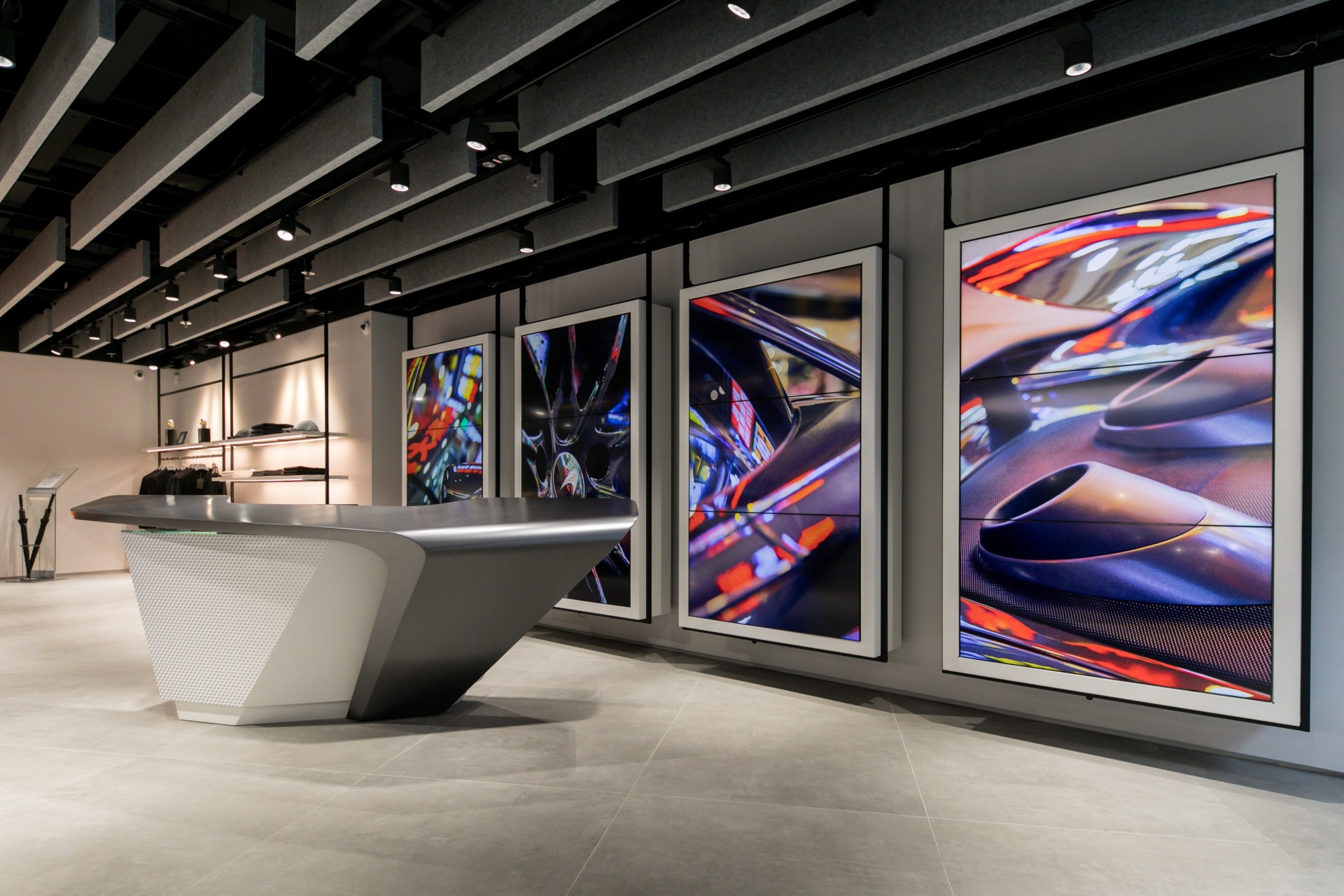 Detail of a modern retail space with displays hanging from the ceiling.