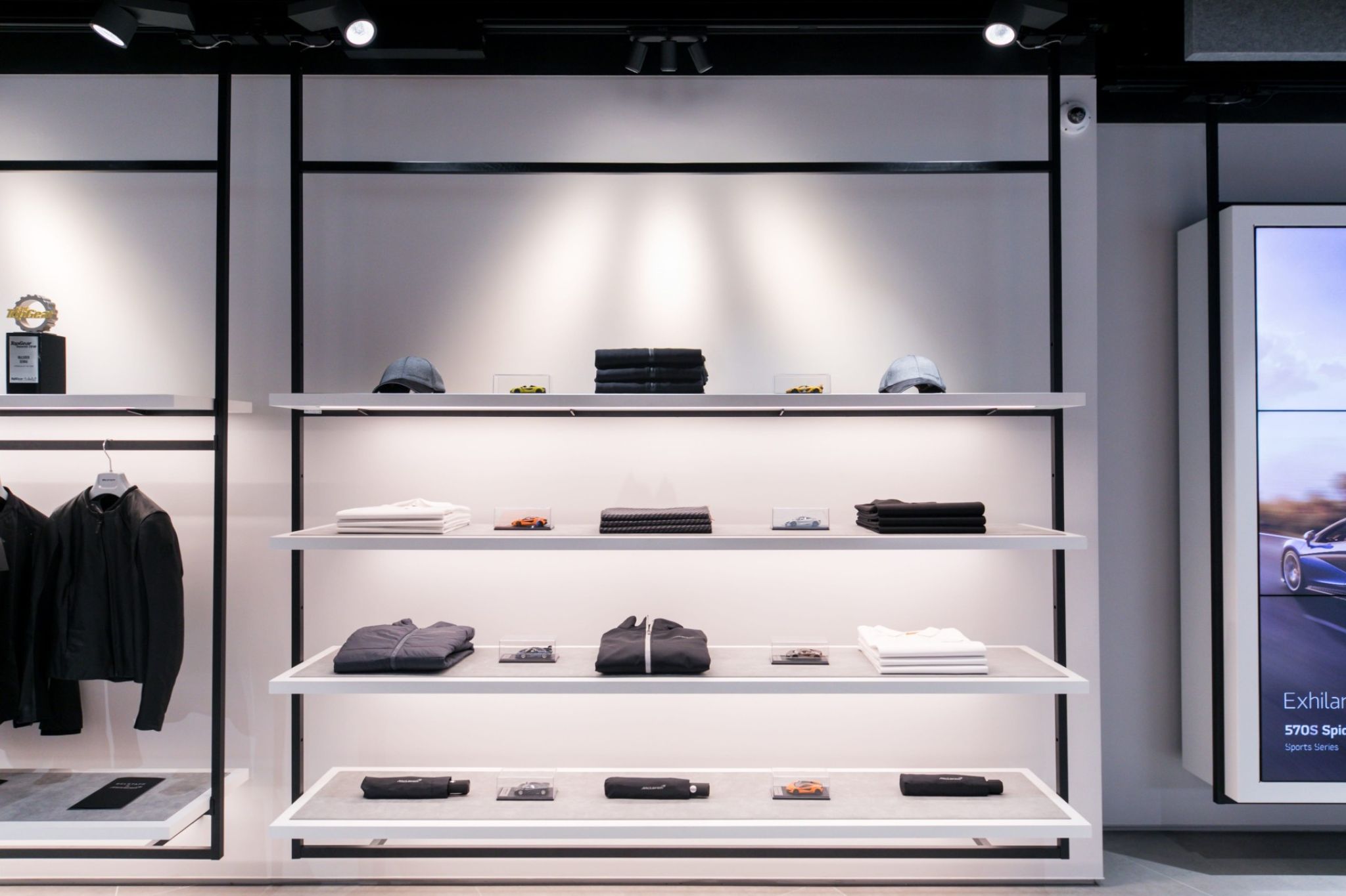 Detail view of goods carrier hanging from the ceiling equipped with goods.