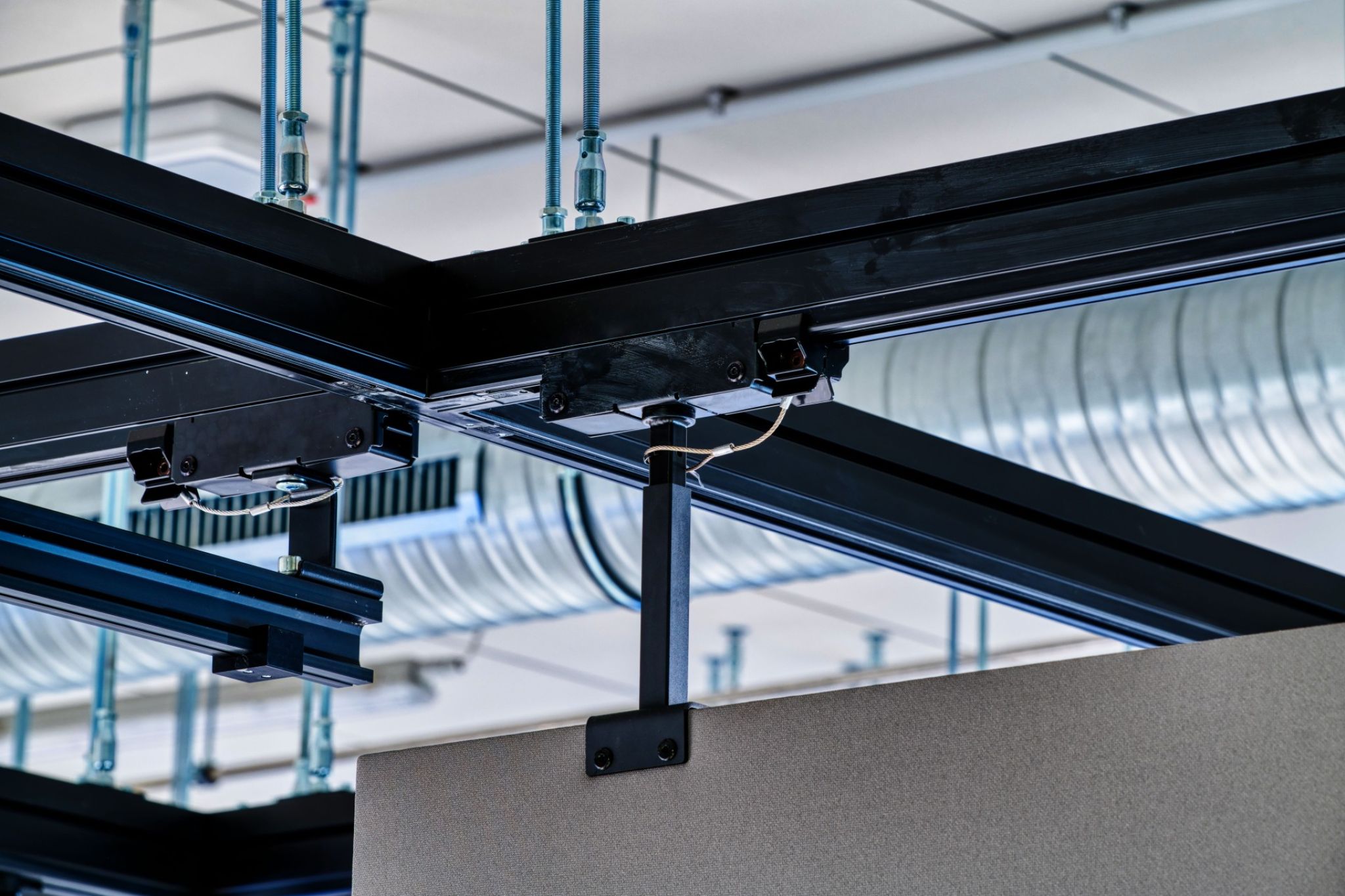 Ceiling rail system with inserted partition.