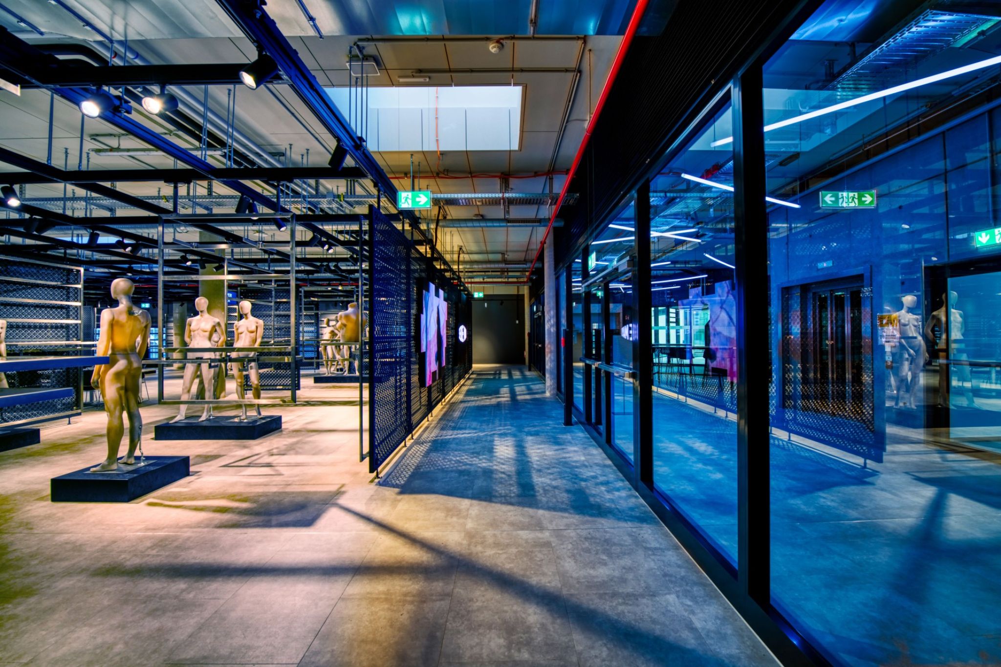 Showroom with glass fronts and mannequins.