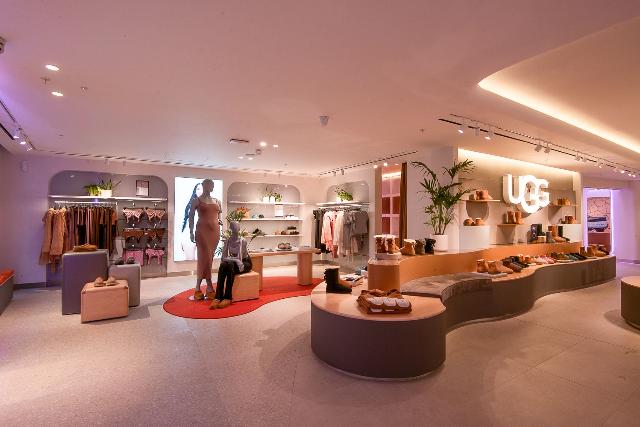 High-quality product presentation in a shoe store with open shelving systems, warm tones, and an inviting atmosphere.