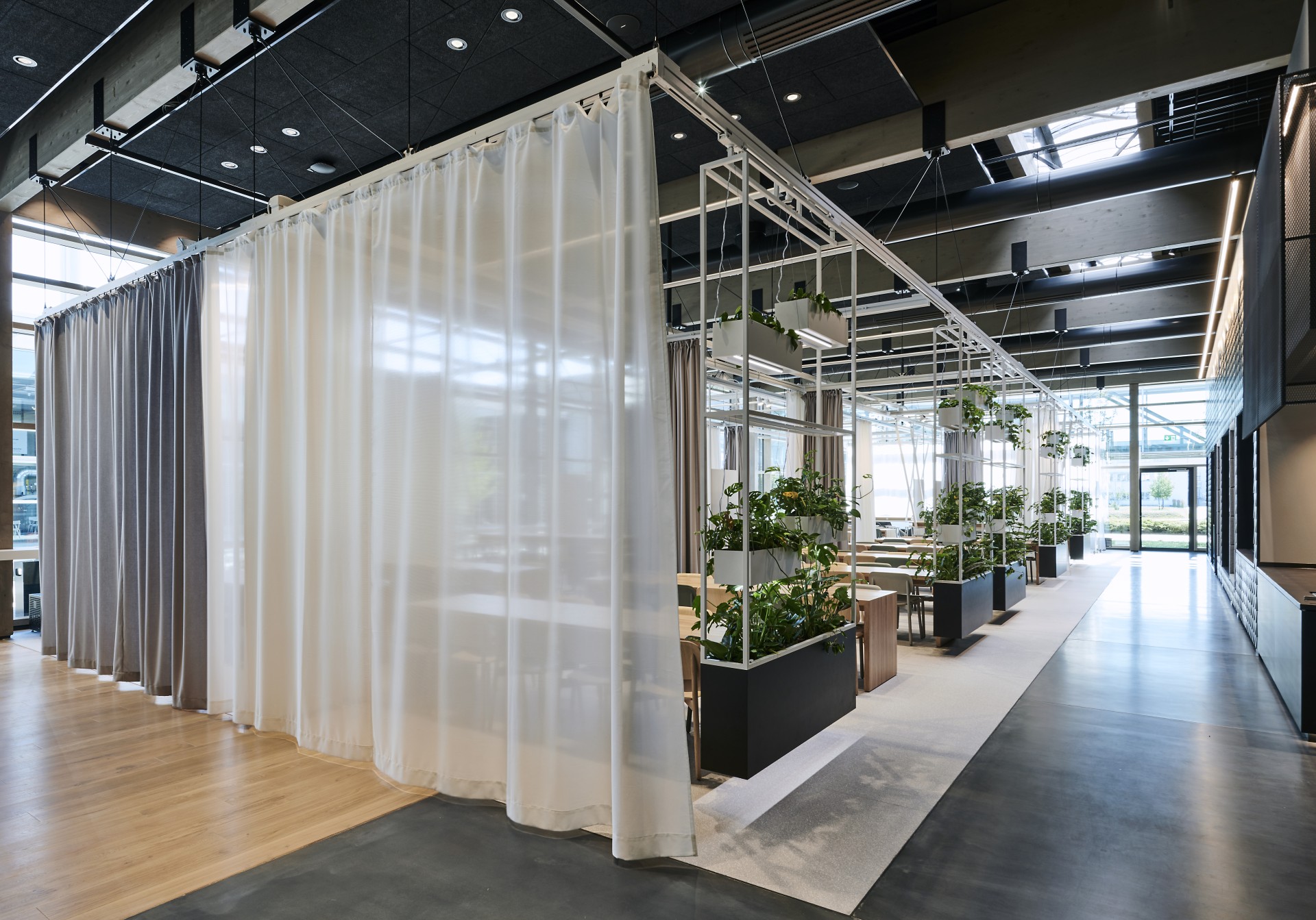 Seating area of a canteen separated by a curtain.